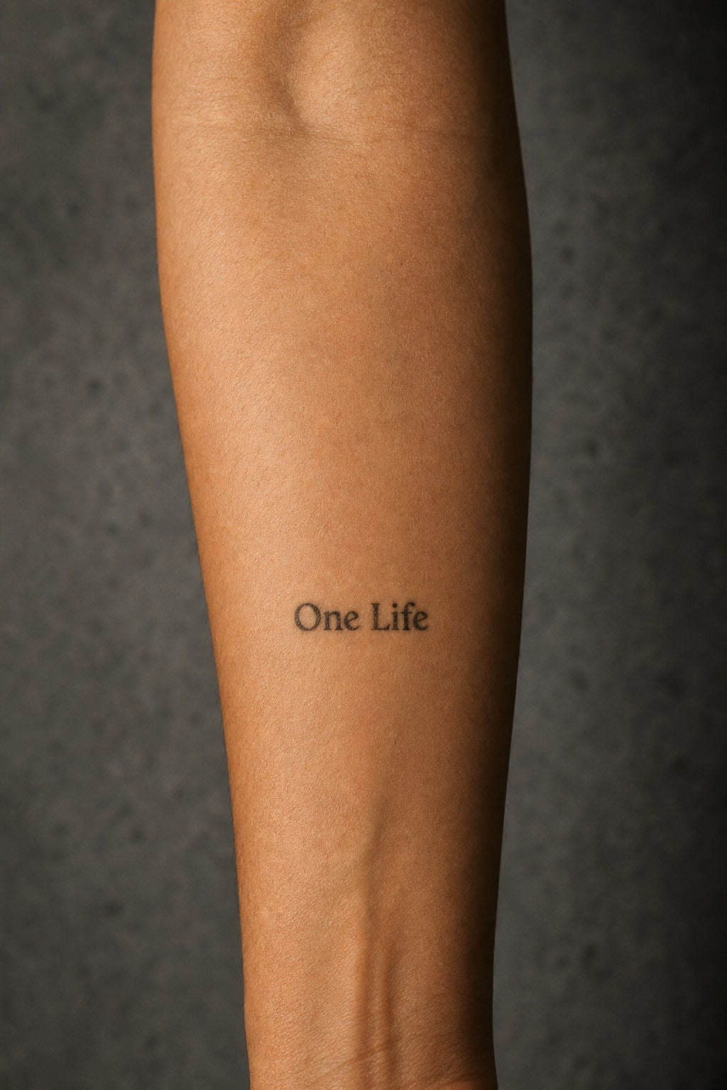 One Life Bold Script on skin